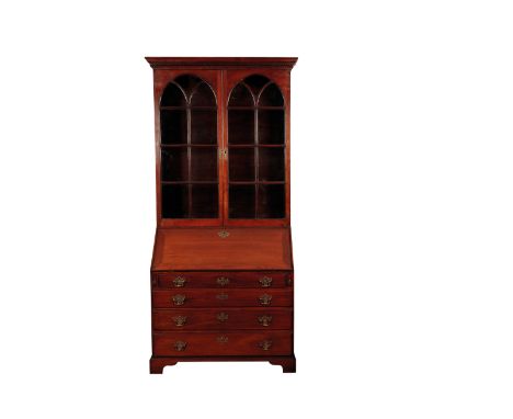 AN ANGLO INDIAN TEAK BUREAU BOOKCASE, CIRCA 1800, the dentil cornice above a pair of arched astragal glazed panel doors enclo