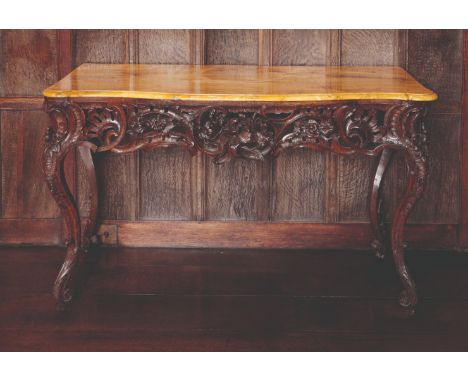 A FINE LOUIS XV WALNUT CONSOLE TABLE the serpentine Sienna-marble top with a moulded edge, over a shaped frieze pierced and c