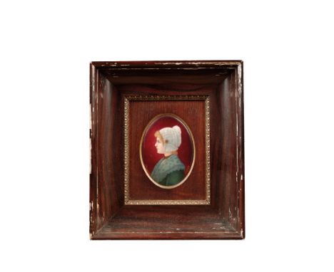 A LIMOGES ENAMEL OVAL PORTRAIT PLAQUE of a young lady wearing a lace cap, inscribed "P. Bonnaud", 11.5cm x 8cm, in simulated 