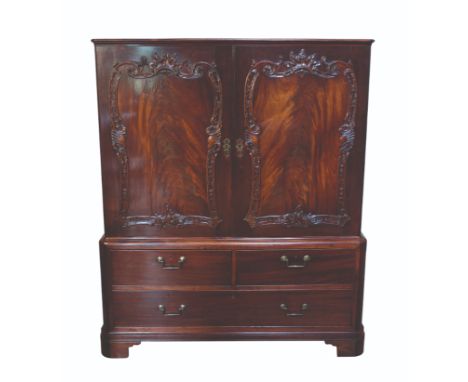 A GEORGE II MAHOGANY LINEN PRESS, the upper section with a pair of doors carved with rococo-cartouches with leafy scrolls, fo
