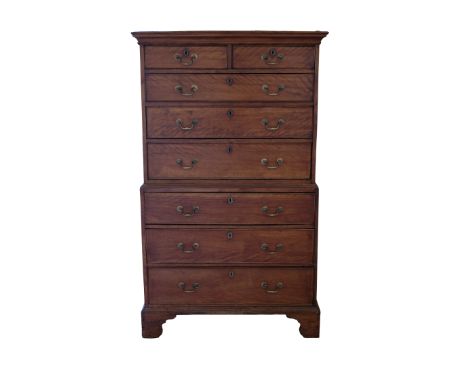 A GEORGE III MAHOGANY CHEST ON CHEST the upper section with a moulded cornice over three graduated drawers and the base with 