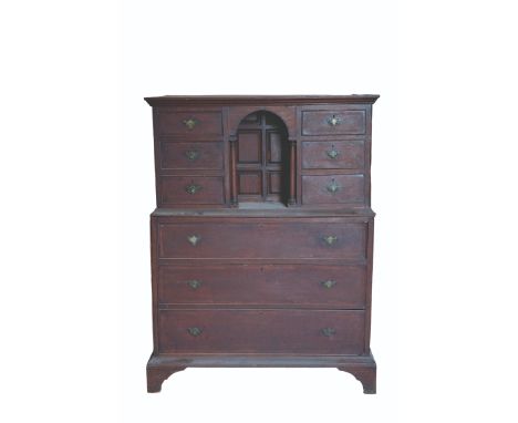 A GEORGE II OAK AND FRUITWOOD BANDED ARCHITECTURAL CHEST ON CHEST, the upper section with an arrangement of six drawers retai