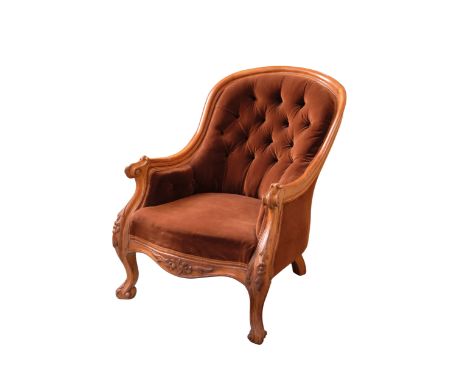 AN EARLY VICTORIAN WALNUT SPOONBACK GENTLEMAN'S ARMCHAIR upholstered in brown deep button material, on floral-carved scroll l