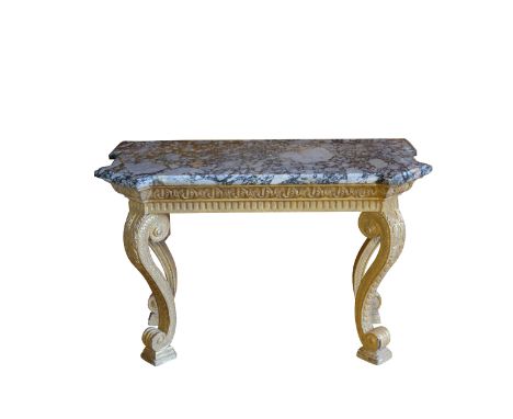 A GEORGE II GILTWOOD CONSOLE TABLE in the manner of William Kent, with a breche violette marble top with canted corners and p