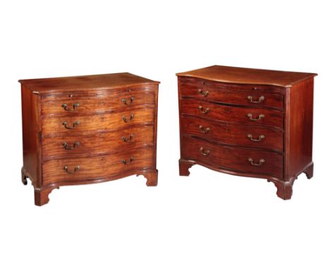 AN IMPORTANT PAIR OF GEORGE III MAHOGANY SERPENTINE CHESTS OF DRAWERS inlaid throughout with chequered stringing and with a b