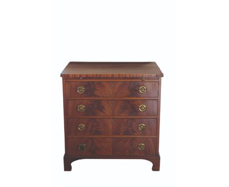 A LATE GEORGE III MAHOGANY CHEST OF DRAWERS, the rectangular top over a brushing slide and four graduated drawers, apparently