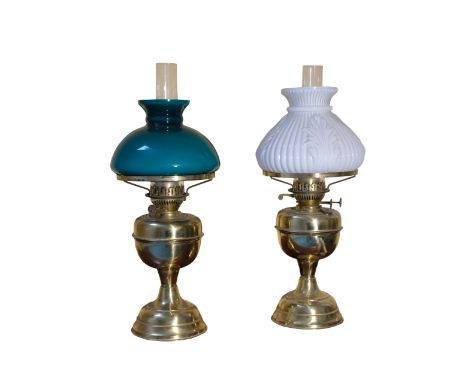 A VICTORIAN STYLE BRASS OIL LAMP with green glass shade, 53cm high; and another with opaline shade (2)