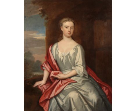 SIR GODFREY KNELLER (1646-1723) A portrait of a young girl wearing an ivory silk gown with red shawl, depicted seatedÂ&nbsp; 