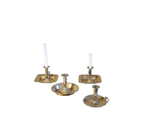 A VICTORIAN BRASS CHAMBER CANDLESTICK with rectangular tray and scissor-action snuffers; and three other brass chamber candle