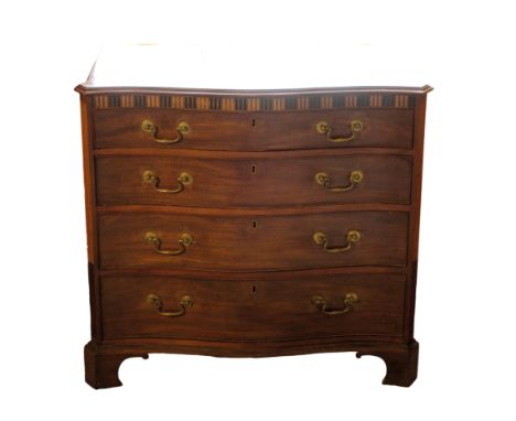 A GEORGE III MAHOGANY AND INLAID SERPENTINE COMMODE, CIRCA 1770, the shaped top with a moulded edge, above a simulated fluted