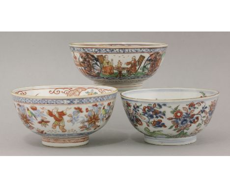 Three Dutch decorated Bowls,18th century, the first decorated with underglaze blue fruiting pomegranate, each plant over-deco