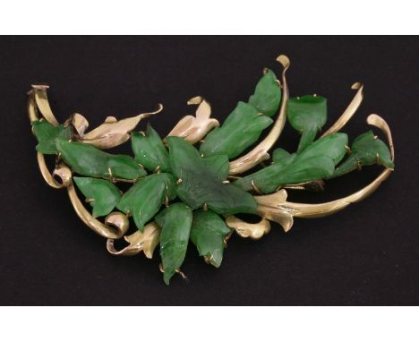 A jade Brooch, c.1950, the emerald stones constructed as a burst of petals, tested approximately 9ct gold,6.5cm, anda pair of