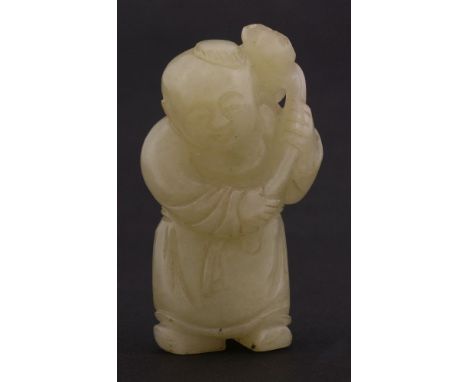 A jade Carving,19th century, of a boy holding a lotus, the stone a mottled grey-green throughout,6cm清十九世纪 青灰玉雕童子执莲把件