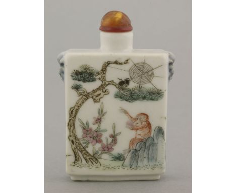 An attractive Snuff Bottle,20th century, of rectangular section, amusingly enamelled with a monkey on a rock pointing at a sp