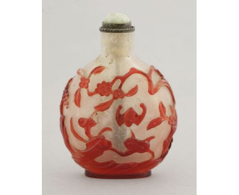 A Peking overlay glass Snuff Bottle,Qianlong (1736-1795), with ruby bats amongst prunus, lingzhi, rockwork, fruiting trees an