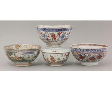 Four Dutch decorated Bowls,18th century, the first with underglaze blue floral sprigs beneath a cash diaper border, overpaint
