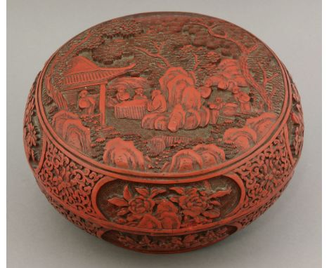 A cinnabar lacquer Box and Cover,probably first half of the 19th century, of bun form, the lid carved with seven figures, lit