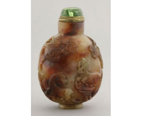 A large jade Snuff Bottle, Qing dynasty (1644-1911), carved with two horses under pine trees, the reverse with a scholar sitt