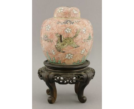 A Chinese jar and cover, 19th century, enamelled with three prancing horses, over waves with auspicious objects and petals ag