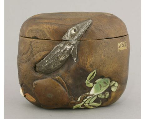 A rare onlaid Tonkotsu (tobacco container),first half of 19th century, the body of kiri wood burl, irregularly inlaid in copp