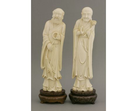 A pair of ivory Immortals,early 20th century, a luohan with fly whisk and ring, smiling into his beard, and his companion wit