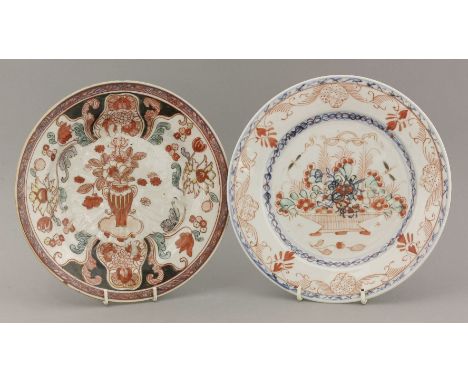 Two Dutch decorated Plates,first half of the 18th century, one with anhua decoration of a large flower head over enamelled in