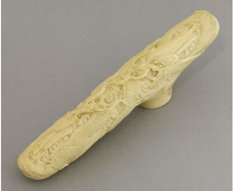 A Canton carved ivory Walking Cane Handle,c.1870, finely carved with two opposing dragons amongst clouds, their eyes inlaid w