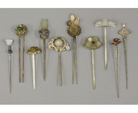 A collection of nine Hairpins,Qing dynasty (1644-1911), with jade finials in the shape of flowers, mounted with metal or cloi