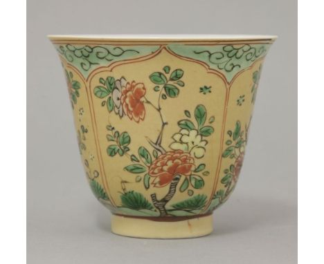 A café au lait-ground Beaker,Kangxi (1662-1722), with four red-bordered lotus panels enclosing peony below a green reserve, u