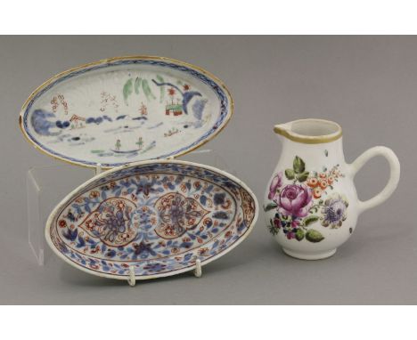 An English decorated Cream Jug,first half of the 18th century, imported in the white and later enamelled with floral sprays o