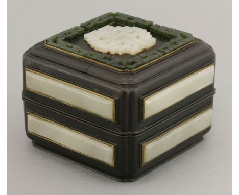 A wooden box and cover, 20th century, of square section, the top inset with pierced and carved white jade pendant and spinach