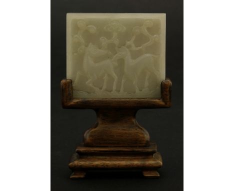 A jade Belt Appliqué,possibly late Ming, of square section, deeply and boldly carved with two deer carrying sprays of lingzhi