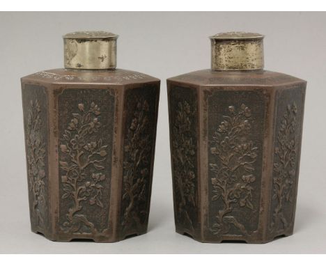 A rare pair of Yixing Tea Canisters,late 17th/early 18th century, each gently flared hexagonal body moulded with panels of a 