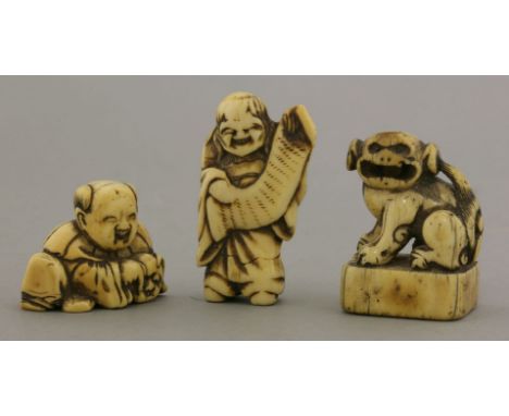 Three ivory Netsuke,various dates, a boy making bekkako with a mask and laughing, a wildman with long hair holding a scroll, 