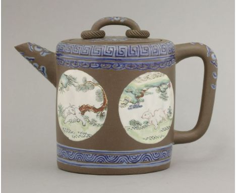 An attractive enamelled Yixing Teapot and Cover,early 19th century, the cylindrical chocolate body with four roundels of a ha