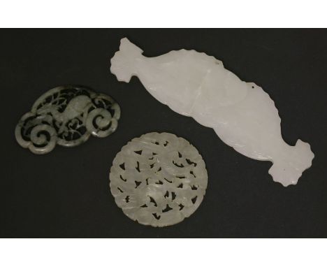 Three jade Carvings,19th/20th century, comprising:an openwork ruyi plaque of a deer,6.5cm long,a circular openwork plaque car