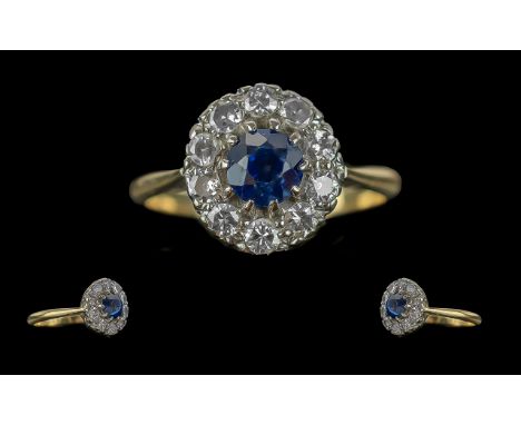 18ct Gold Diamond and Sapphire Set Cluster Ring. Marked 18ct to Interior of Shank. The Blue Faceted Sapphire Surrounded by 12