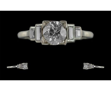 Art Deco Superb Platinum Diamond Set Dress Ring, the interior and shank marked Platinum.  The central round faceted diamond o