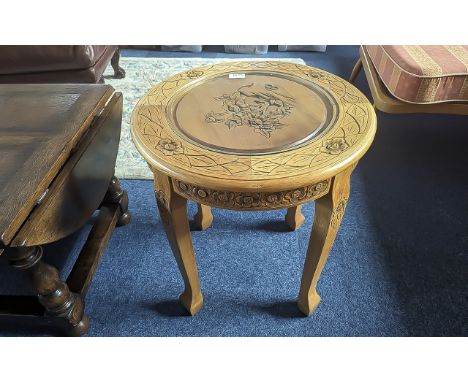 Carved Round Lamp Table with Glass Top, raised on four turned legs, measures 20'' diameter x 22'' high.