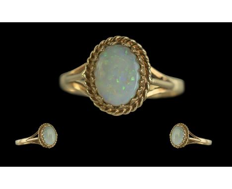 Ladies Attractive 9ct Gold Single Stone Opal Set Ring full hallmark to interior of shank the opal of green, orange, bluey col