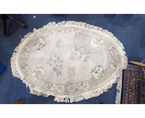 Collection of Three Rugs to include a Rectangular Wool Rug in pale green with floral pattern, measures approx.  6' x 4', Oval