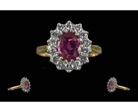Ladies 18ct Gold Pleasing Ruby and Diamond Set Ring. Marked 750 - 18ct to Interior of Shank. Ruby of Good Colour, Surrounded 