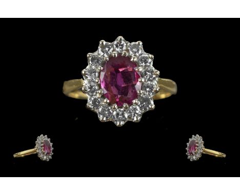 Ladies 18ct Gold Pleasing Ruby and Diamond Set Ring. Marked 750 - 18ct to Interior of Shank. Ruby of Good Colour, Surrounded 