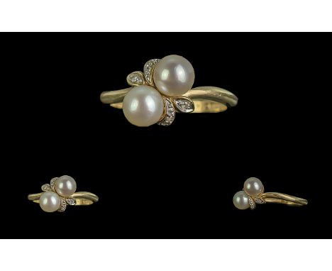 Ladies Attractive 9ct Gold Pearl and Diamond set Ring not marked tests gold the two cultured pearls of good lustre with diamo