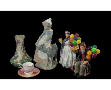 A Mixed Lot of Pottery to include Royal Doulton the Balloon man, Royal Doulton Biddy Penny Farthing, 1990 Royal Worcester Lon