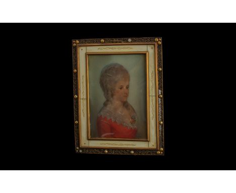 Early to mid century Portrait Miniature of a young woman, with elaborate hair and evening dress, piano keyboard fretwork fram