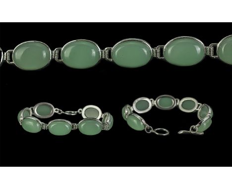 Jade Bracelet, seven oval jade stones set in white metal.
