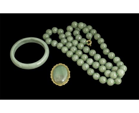 Jade Bead Necklace, together with a bangle and brooch.