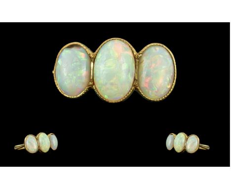 Antique Period Pleasing 18ct Gold 3 Stone Opal Set Ring, circa 1900.  The well-matched oval shaped opals of good colour and c