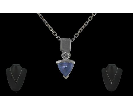 14ct White Gold Tanzanite Pendant, suspended on a chain marked 585 Italy.  Drop pendant in arrow shape set with a triangle sh